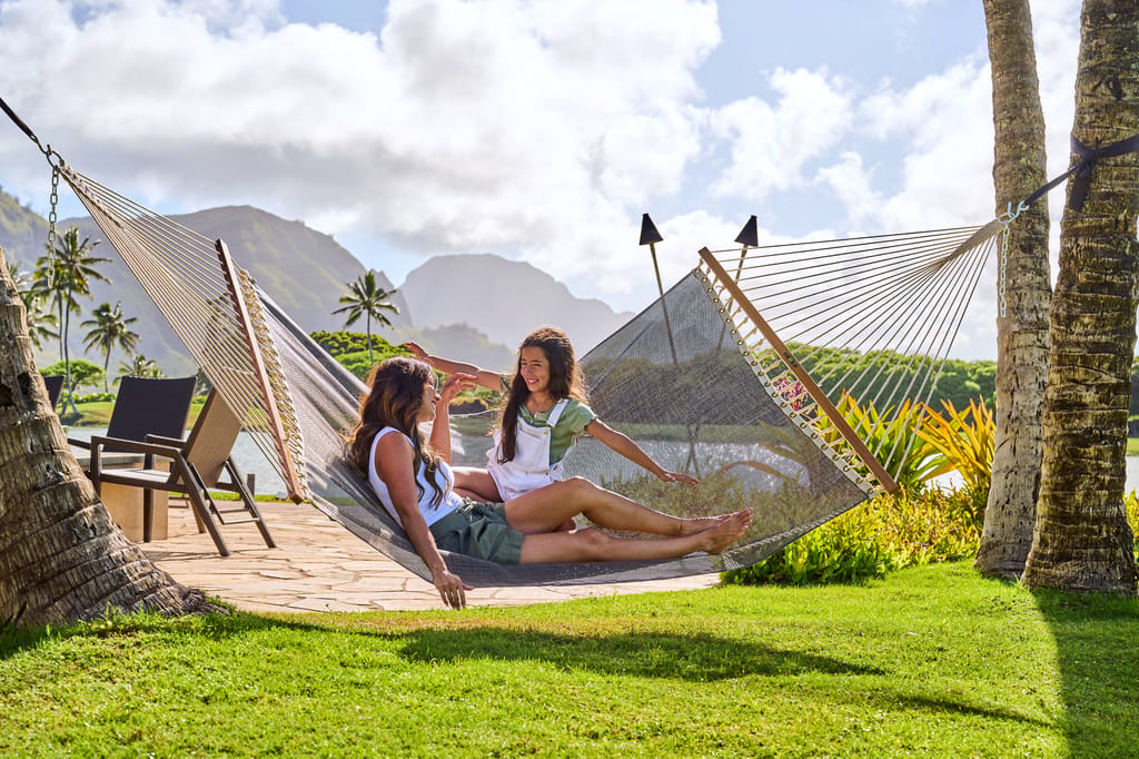 family enjoying the hammock at Timbers Kauai