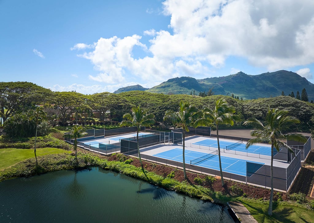 Aerial view of the Courts at Hokuala (tennis and pickleball) with the Hāʻupu Mountains in the background