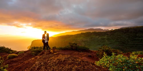 Beautiful landscape view with couple standing together near mirador de Abrante on La Gomera island on the sunrise